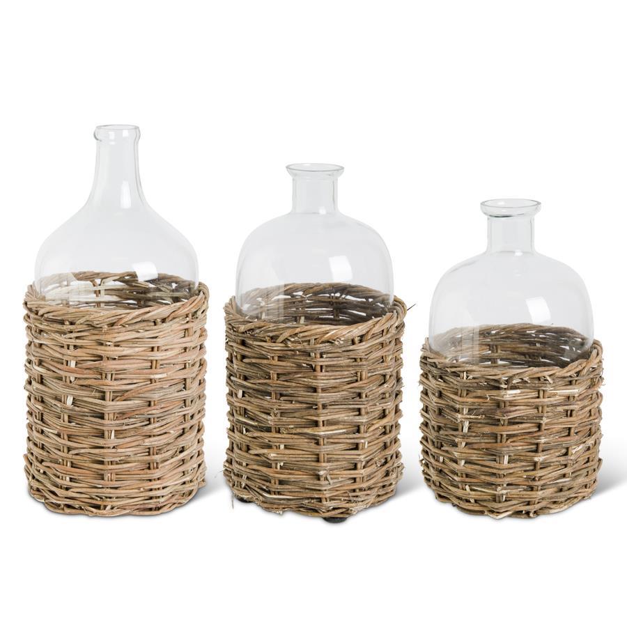 Clear Glass Bottles in Woven Rattan Baskets