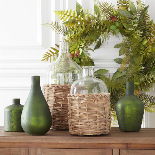 Clear Glass Bottles in Woven Rattan Baskets